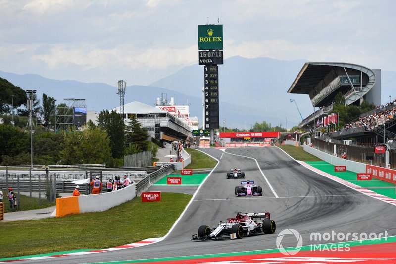 Kimi Raikkonen, Alfa Romeo Racing C38, leads Sergio Perez, Racing Point RP19