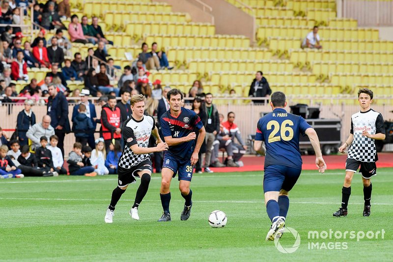 Mick Schumacher and Mark Webber play football