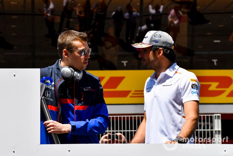 Daniil Kvyat, Toro Rosso, talks with Carlos Sainz Jr., McLaren, at the drivers parade