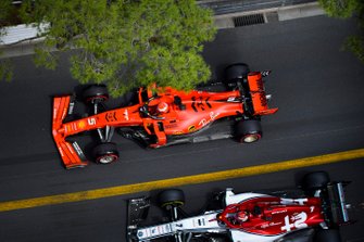 Sebastian Vettel, Ferrari SF90, passes Kimi Raikkonen, Alfa Romeo Racing C38
