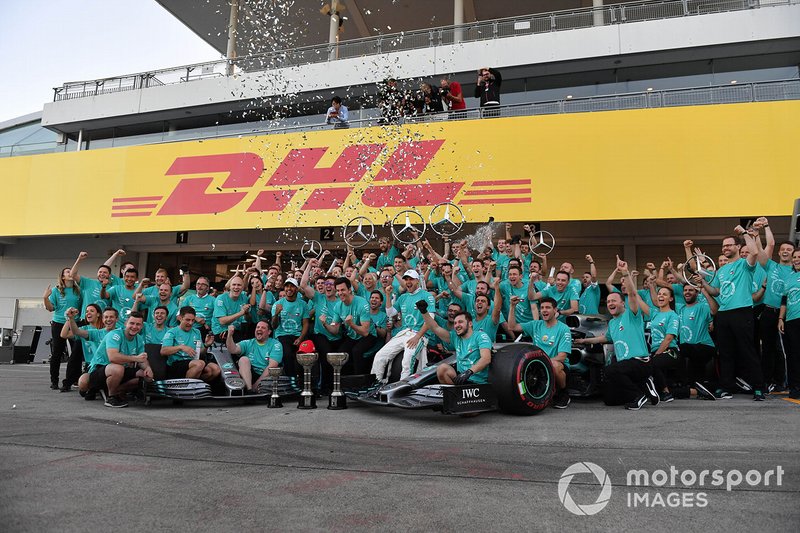 The Mercedes team celebrates after clinching their record 6th consecutive Constructors title