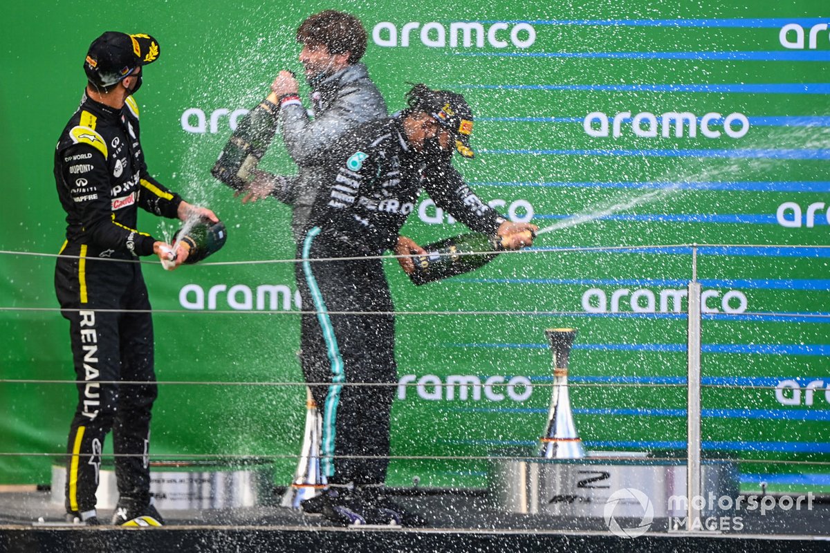 Daniel Ricciardo, Renault F1, 3rd position, and Lewis Hamilton, Mercedes-AMG F1, 1st position, celebrate on the podium with Champagne