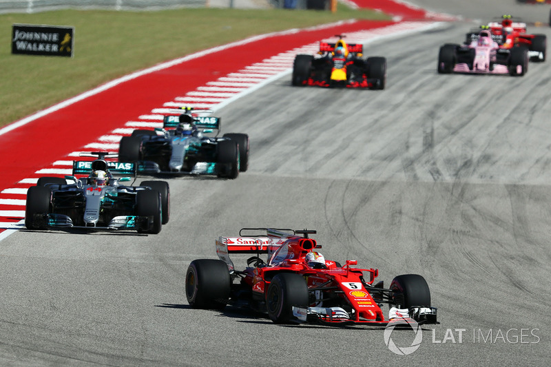 Sebastian Vettel, Ferrari leads Lewis Hamilton, Mercedes AMG F1 W08