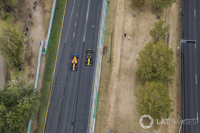 Fernando Alonso, McLaren MCL33 Renault, passes Carlos Sainz Jr., Renault Sport F1 Team R.S. 18