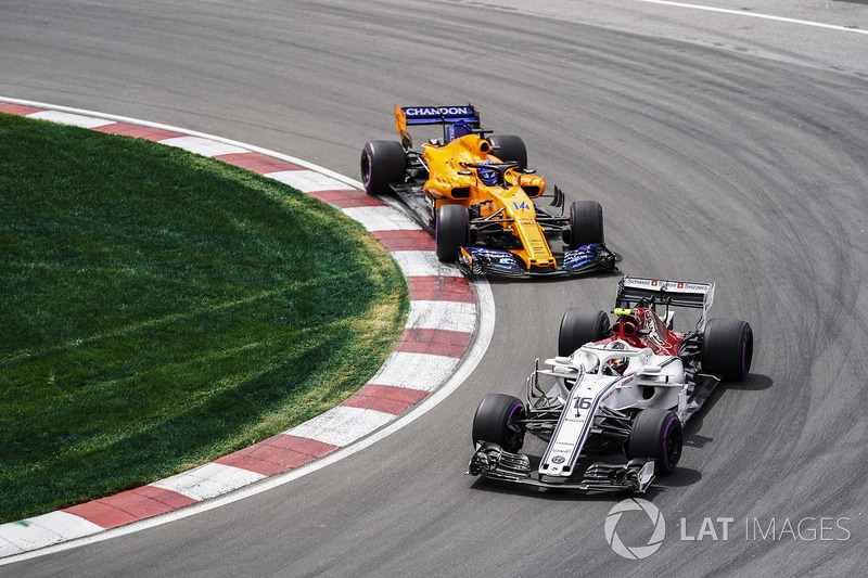 Charles Leclerc, Sauber C37, leads Fernando Alonso, McLaren MCL33