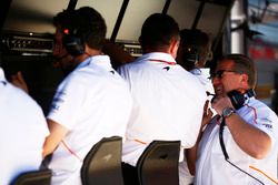 Eric Boullier, Racing Director, McLaren, talks with Zak Brown, Executive Director, McLaren Technology Group, on the McLaren pit wall