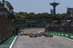 Valtteri Bottas, Mercedes-Benz F1 W08 and Sebastian Vettel, Ferrari SF70H battle for the lead at the start of the race