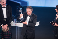Nelson Piquet collects his Gregor Grant Award on stage with Gordon Murray