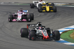 Romain Grosjean, Haas F1 Team VF-18, leads Sergio Perez, Force India VJM11, and Carlos Sainz Jr., Renault Sport F1 Team R.S. 18
