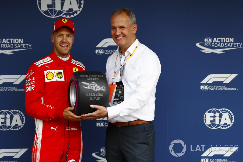 Sebastian Vettel, Ferrari, receives the Pirelli pole position award