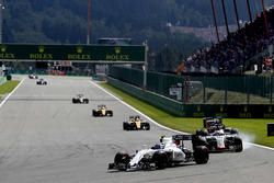 Valtteri Bottas, Williams FW38 Mercedes, leads Romain Grosjean, Haas VF-16 Ferrari