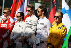 Nico Hulkenberg, Sahara Force India F1 and Jenson Button, McLaren as the grid observes the national