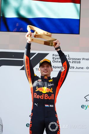 Max Verstappen, Red Bull Racing, 1st position, lifts his trophy on the podium