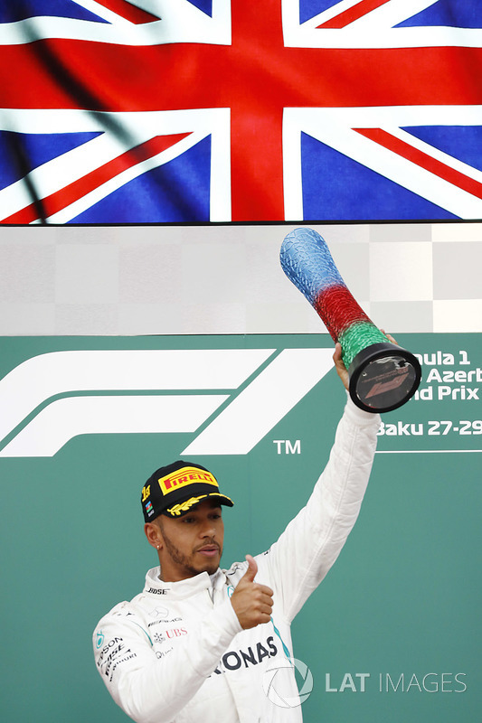 Lewis Hamilton, Mercedes AMG F1, celebrates on the podium after winning the race