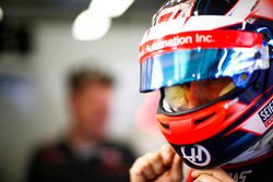 Romain Grosjean, Haas F1 Team, puts on his helmet in the garage