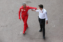 Maurizio Arrivabene, Team Principal, Ferrari, with Toto Wolff, Executive Director (Business), Mercedes AMG