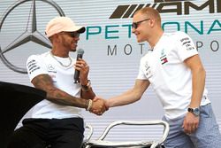 Lewis Hamilton, Mercedes AMG F1, shakes hands with Valtteri Bottas, Mercedes AMG F1, on stage