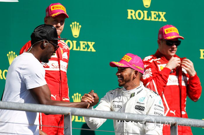 Podio: ganador de la carrera Lewis Hamilton, Mercedes AMG F1, segundo lugar Sebastian Vettel, Ferrari, tercer lugar  Kimi Raikkonen, Ferrari y Usain Bolt