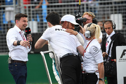 Pole sitter Lewis Hamilton, Mercedes-AMG F1 celebrates in parc ferme as Will Buxton, looks on