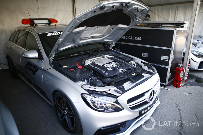 An AMG Mercedes medical car is parked with its bonnet raised