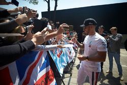 Lewis Hamilton, Mercedes AMG F1, signs autographs for fans