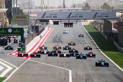 Lando Norris, Carlin, leads Sergio Sette Camara, Carlin and the rest of the field at the start of th