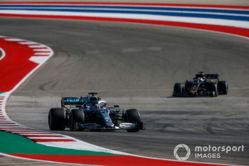 Lewis Hamilton, Mercedes AMG F1 W10, leads Romain Grosjean, Haas VF-19