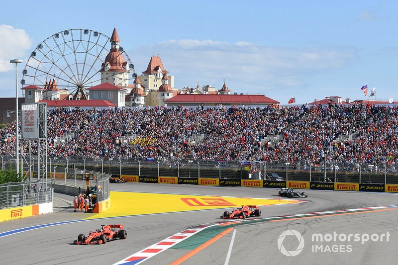 Sebastian Vettel, Ferrari SF90, leads Charles Leclerc, Ferrari SF90