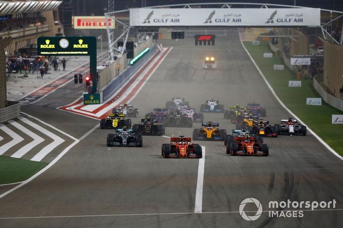 Sebastian Vettel, Ferrari SF90, Charles Leclerc, Ferrari SF90, Lewis Hamilton, Mercedes AMG F1 W10, Valtteri Bottas, Mercedes AMG W10, Max Verstappen, Red Bull Racing RB15, Kevin Magnussen, Haas F1 Team VF-19, and the rest of the field at the start