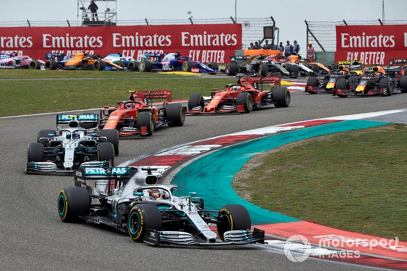 Lewis Hamilton, Mercedes AMG F1 W10, leads Valtteri Bottas, Mercedes AMG W10, Charles Leclerc, Ferrari SF90, Sebastian Vettel, Ferrari SF90, and Max Verstappen, Red Bull Racing RB15, on the opening lap