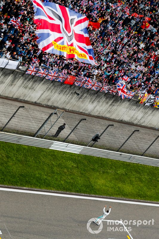 Lewis Hamilton, Mercedes AMG F1, 1st position, celebrates with fans on the track at the end of the race