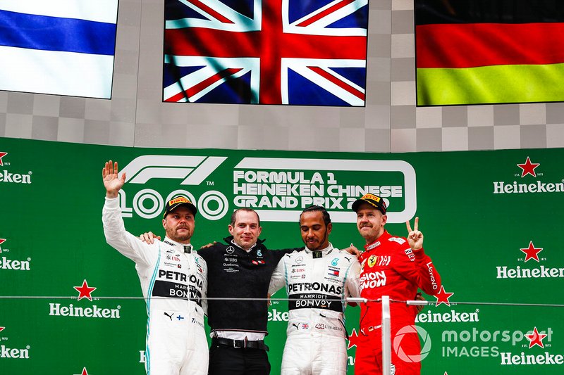 Valtteri Bottas, Mercedes AMG F1, 2nd position, Lewis Hamilton, Mercedes AMG F1, 1st position, and Sebastian Vettel, Ferrari, 3rd position, on the podium