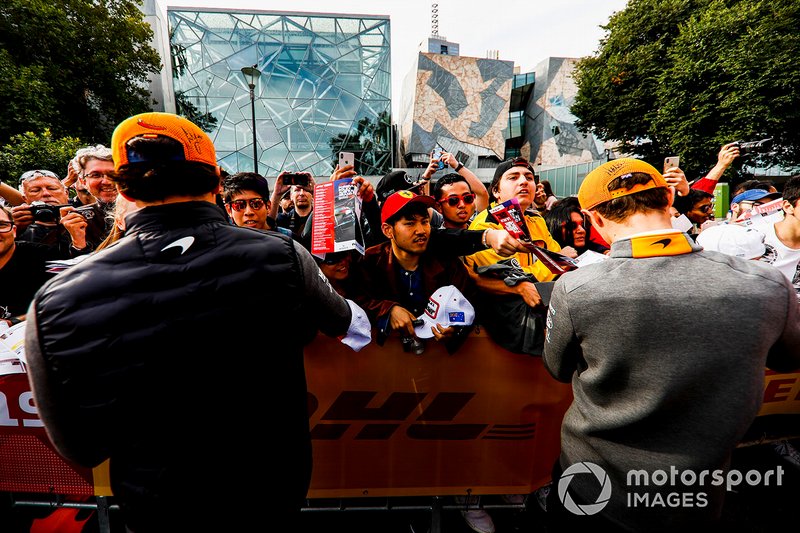 Carlos Sainz Jr., McLaren and Lando Norris, McLaren sign autographs for fans at the Federation Square event