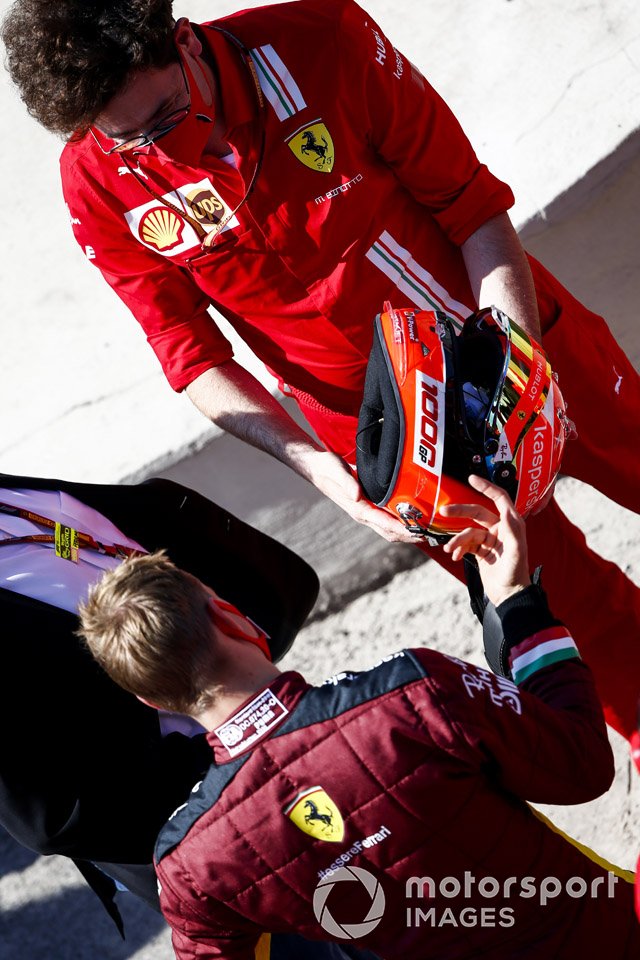 Mattia Binotto, Team Principal Ferrari, presents Mick Schumacher with a special helmet based on the design of his fathers, prior to him driving the championship winning Ferrari F2004