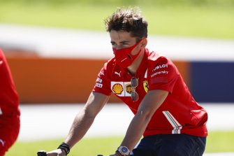 Charles Leclerc, Ferrari walks the track on a bike