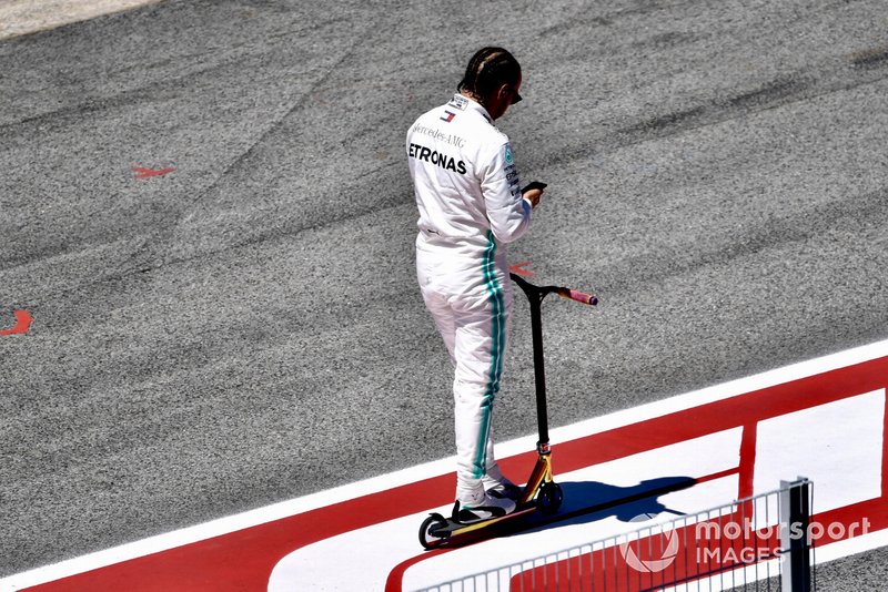 Lewis Hamilton, Mercedes AMG F1, on a scooter