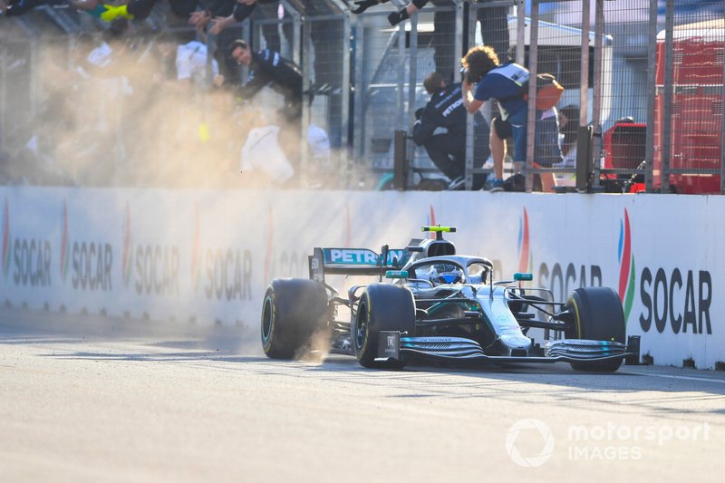 Valtteri Bottas, Mercedes AMG W10, 1st position, passes his team on the pit wall