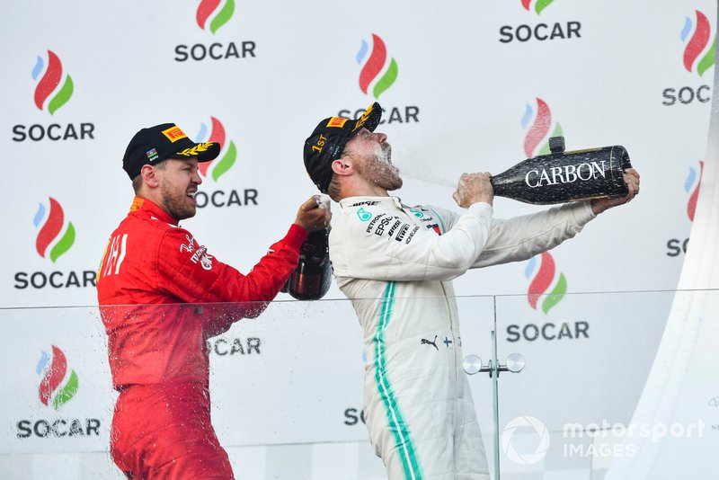 Valtteri Bottas, Mercedes AMG F1, 1st position, blasts himself with Champagne on the podium