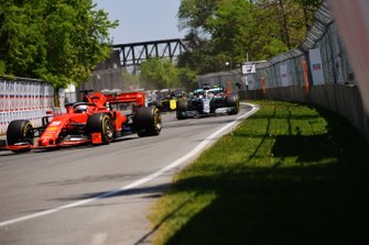 Sebastian Vettel, Ferrari SF90, leads Lewis Hamilton, Mercedes AMG F1 W10, Charles Leclerc, Ferrari SF90, Daniel Ricciardo, Renault R.S.19, Pierre Gasly, Red Bull Racing RB15, and Nico Hulkenberg, Renault R.S. 19, at the start