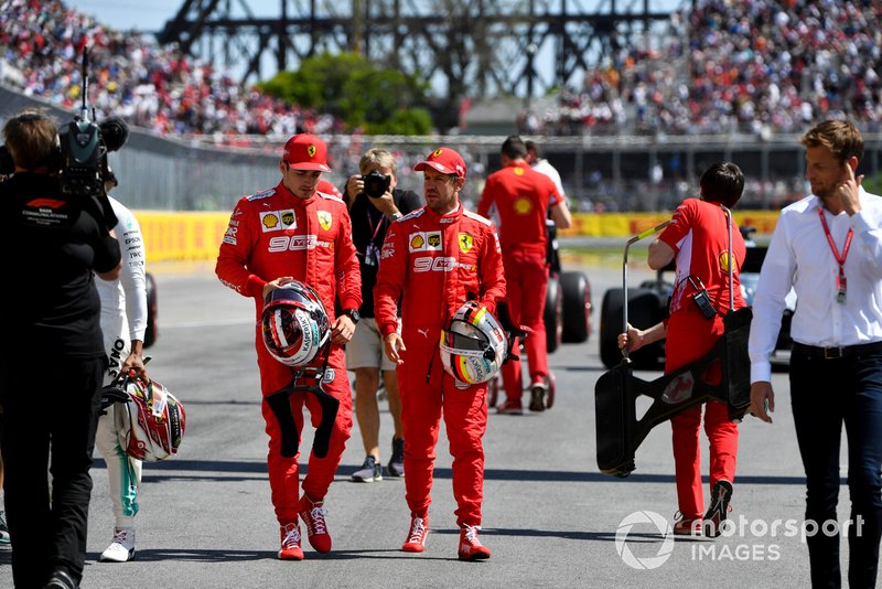 Charles Leclerc, Ferrari, talks with pole man Sebastian Vettel, Ferrari, after Qualifying
