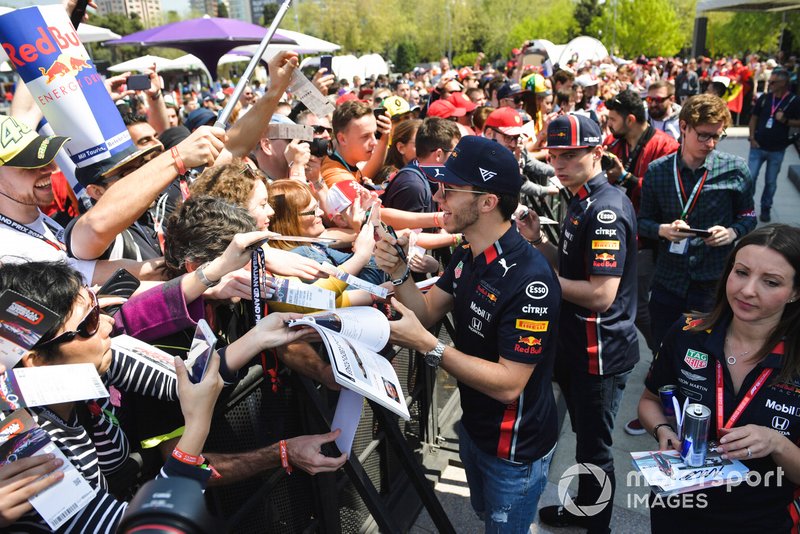 Max Verstappen, Red Bull Racing and Pierre Gasly, Red Bull Racing sign autographs for fans