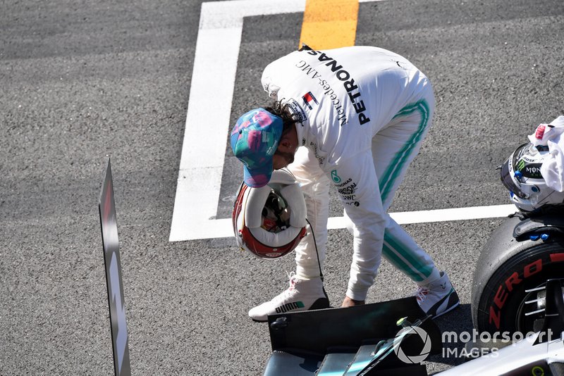 Lewis Hamilton, Mercedes AMG F1, inspects his car after Qualifying