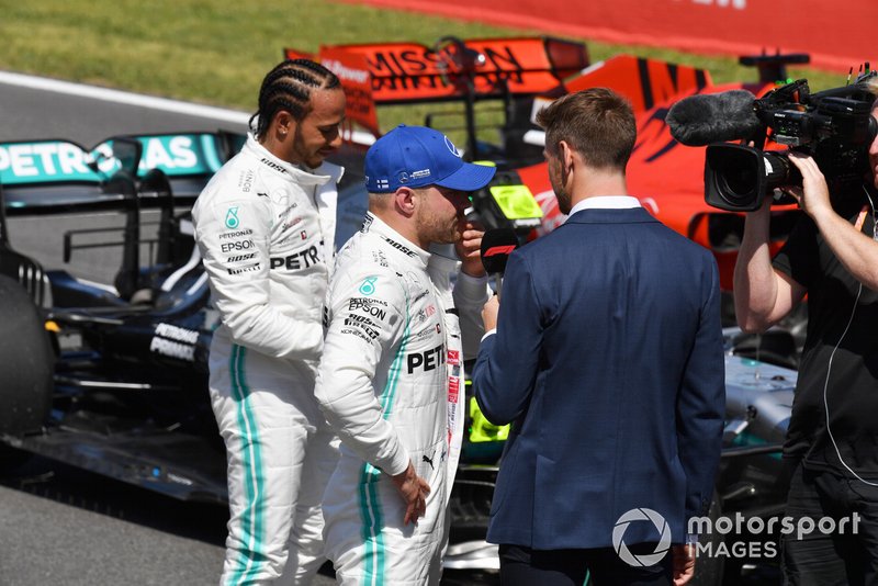 Pole man Valtteri Bottas, Mercedes AMG F1, and Lewis Hamilton, Mercedes AMG F1, are interviewed by Jenson Button, Sky Sports F1, after Qualifying