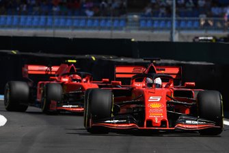 Sebastian Vettel, Ferrari SF90, leads Charles Leclerc, Ferrari SF90