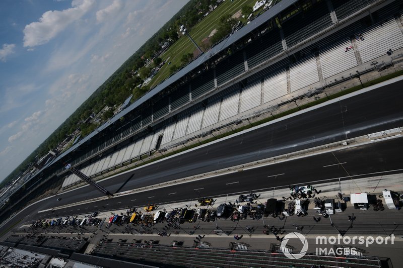 The cars pull out of pit lane for the first practice