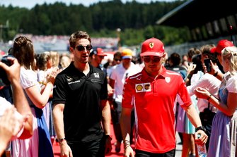 Romain Grosjean, Haas F1, and Charles Leclerc, Ferrari, in the drivers parade