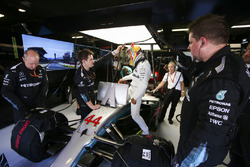Lewis Hamilton, Mercedes AMG F1, climbs in to his car in the garage, prior to heading to the front of the grid