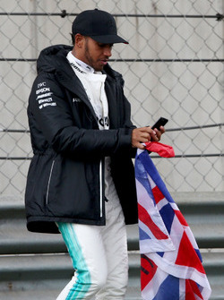 Lewis Hamilton, Mercedes AMG, takes to the track to entertain the fans and picks up a Union Flag