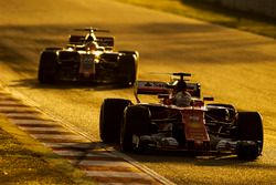 Sebastian Vettel, Ferrari SF70H, leads Kevin Magnussen, Haas F1 Team VF-17