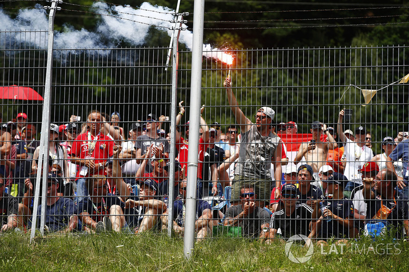 A fan lights a flare